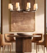 black color hammered brass chandelier are displayed on the dining table in the restaurant.