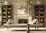 a living room scene picture showing a modern brass linear chandelier with crystal glass