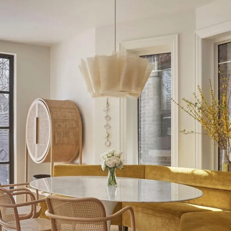 three aegis linen pendant light hanging in a livingroom