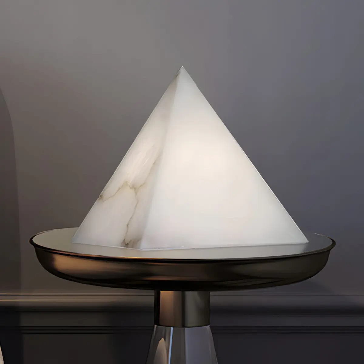 Alabaster pyramid table lamp on a side table