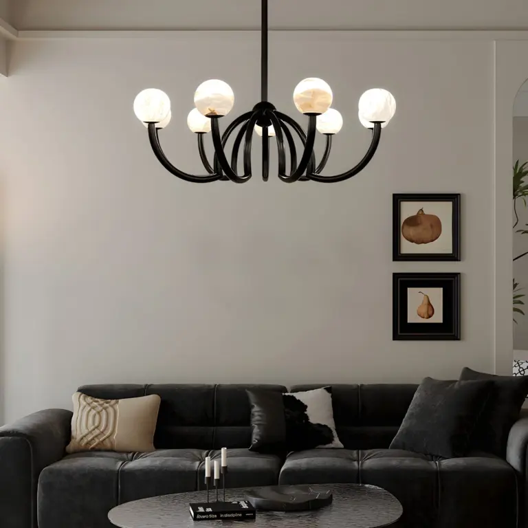 black cluster ball chandelier hanging above a black sofa