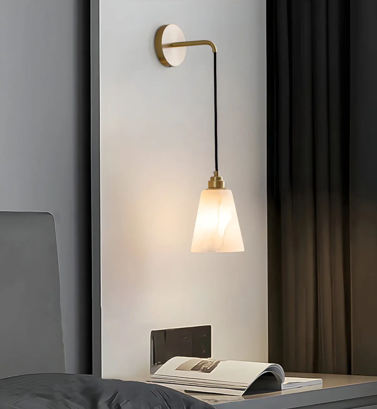 Droplet Wall Lamp hanging beside a modern bed with a magazine on the table