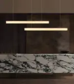 I-linear marble pendant light hanging at reception area