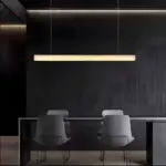 I-linear marble pendant light hanging above table
