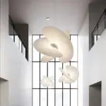 three levante chandelier hanging from ceiling