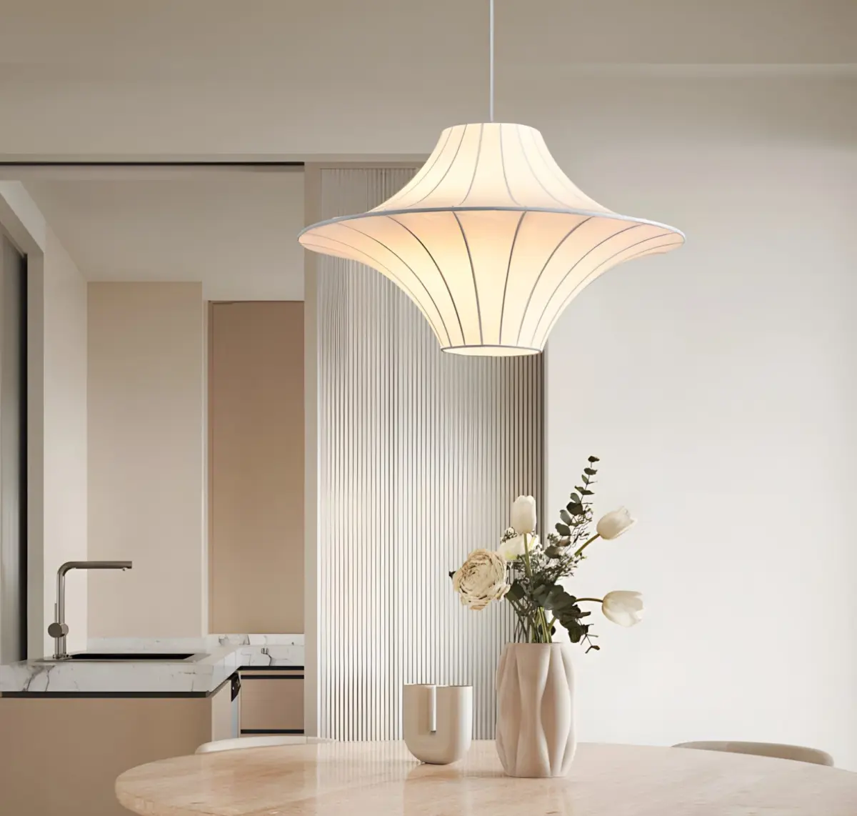 lokki saucer silk pendant light hang above a round table