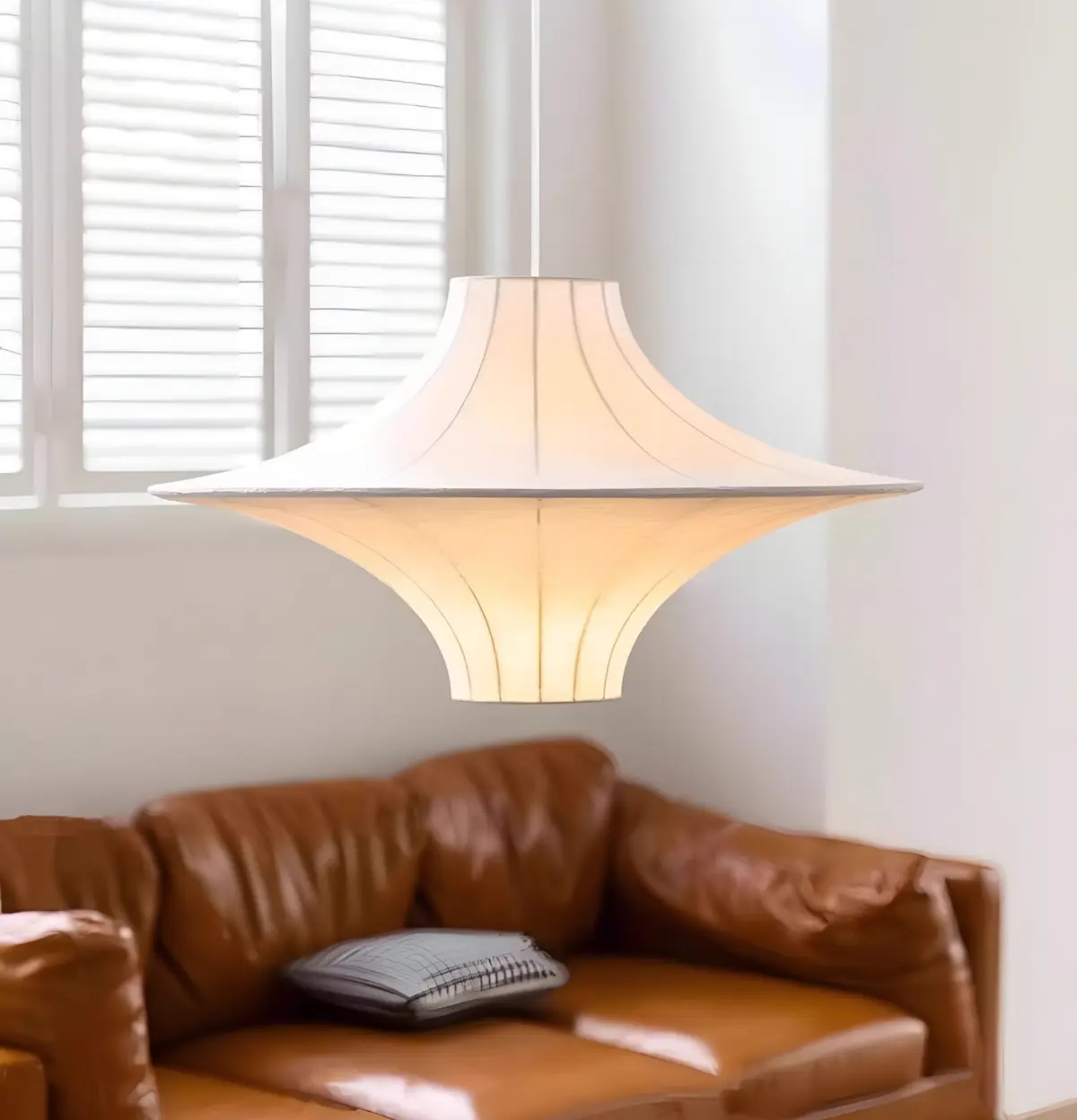 lokki saucer silk pendant hang above sofa