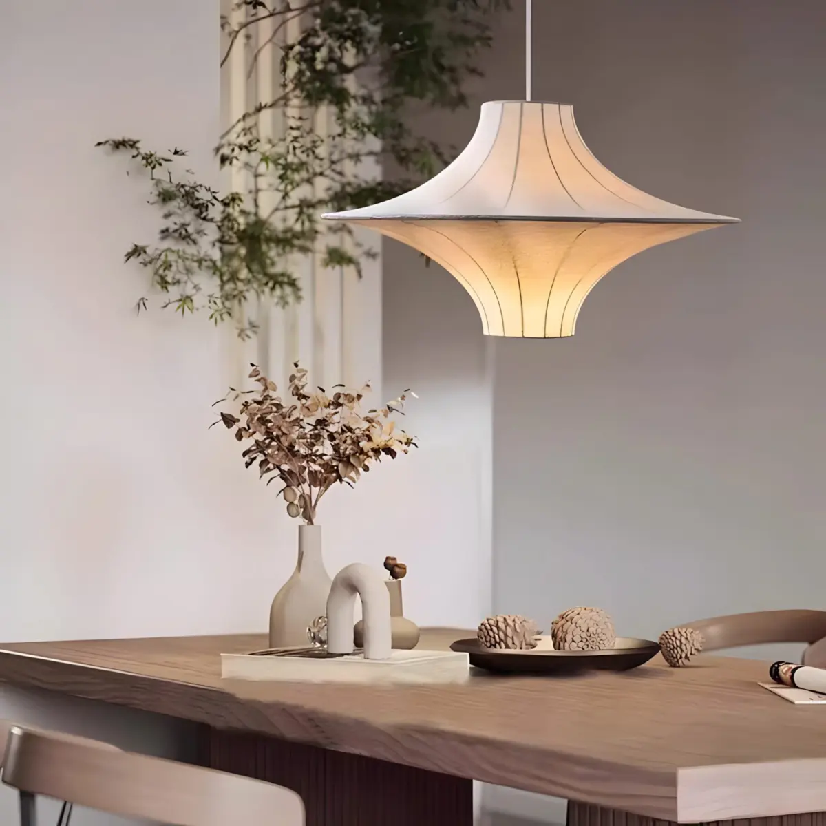 lokki saucer silk pendant hang above dining table