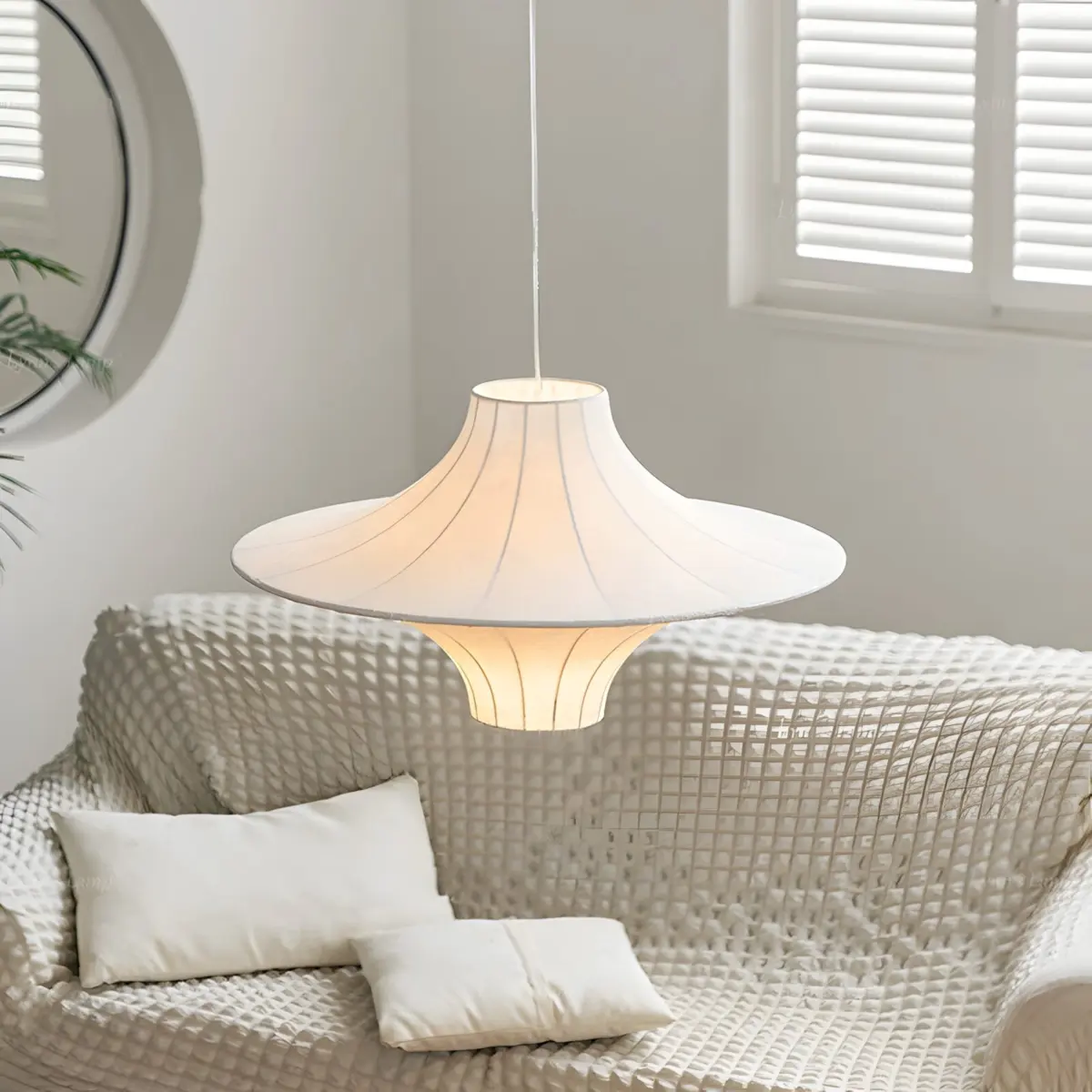 lokki saucer silk pendant hang above sofa