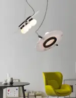 magma alabaster pendant light hanging in a small corner of a green chair