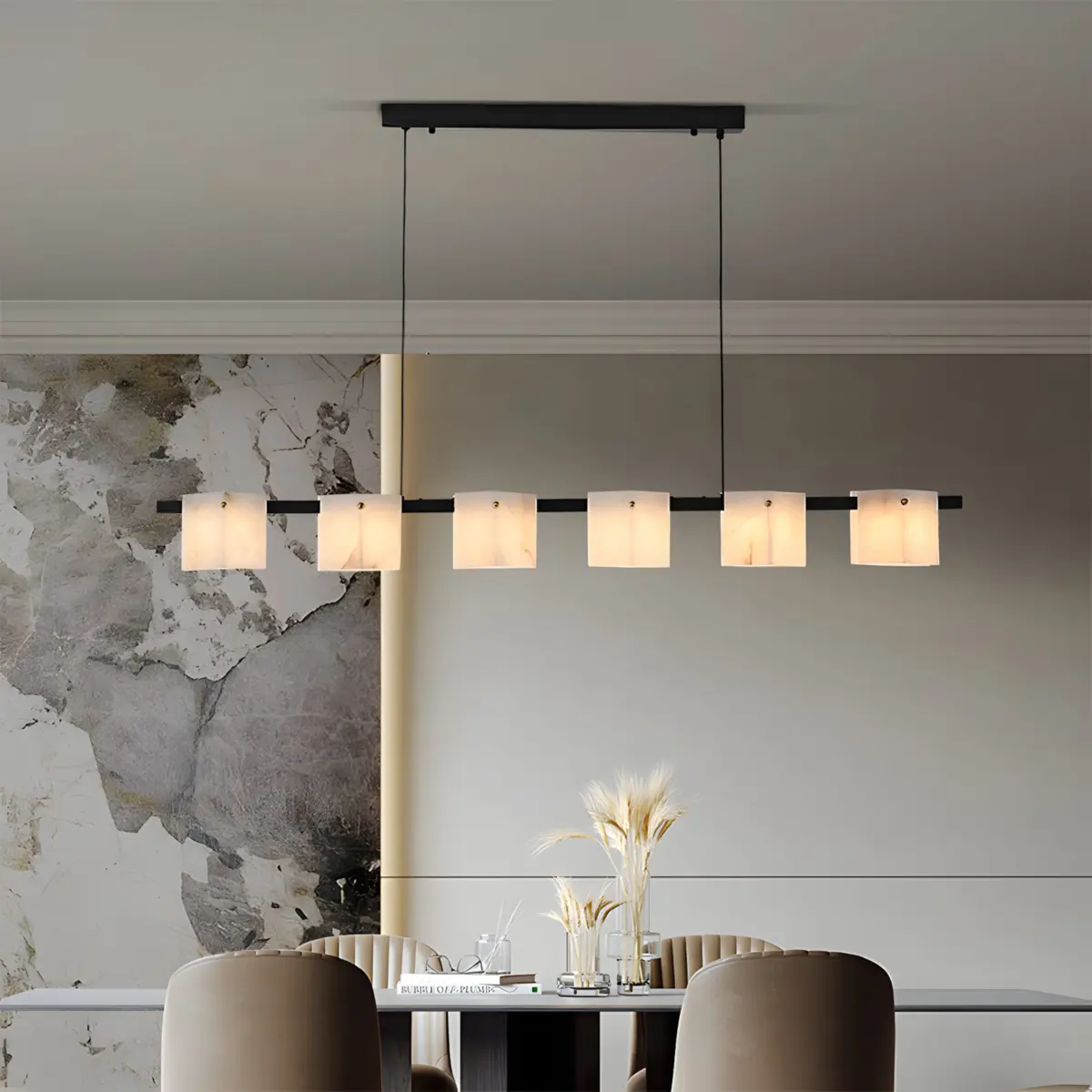 marble linear chandelier hanging above the table