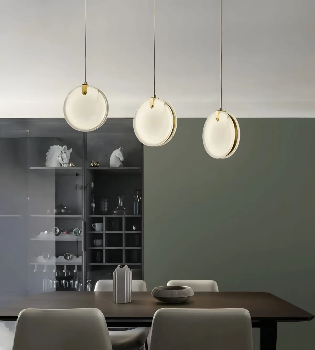 three marble plate pendant light hanging at the dining room
