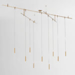 Suspended adjustable brass multi-drop chandelier