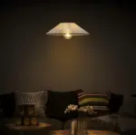 prismatic fabric pendant hanging above sofa