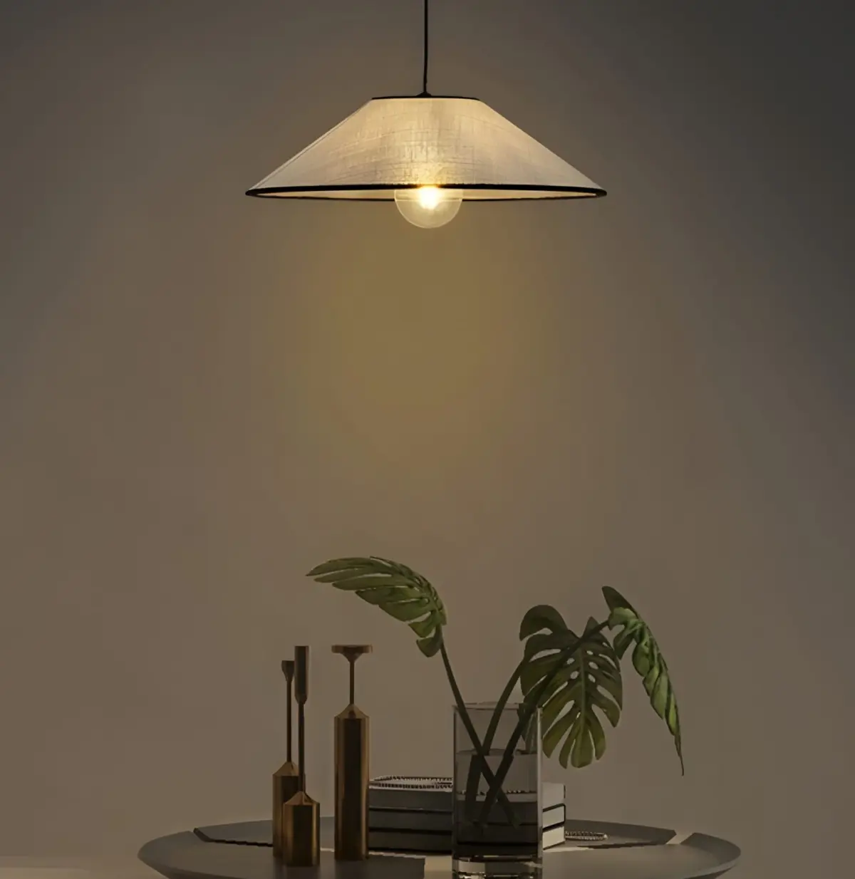 prismatic fabric pendant hanging above a side table