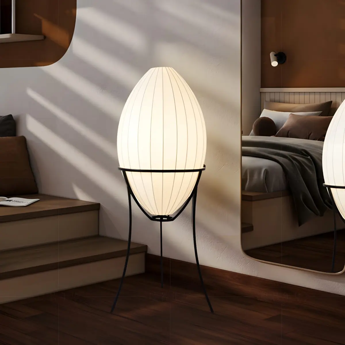 renée egg shaped floor lamp in front of a mirror