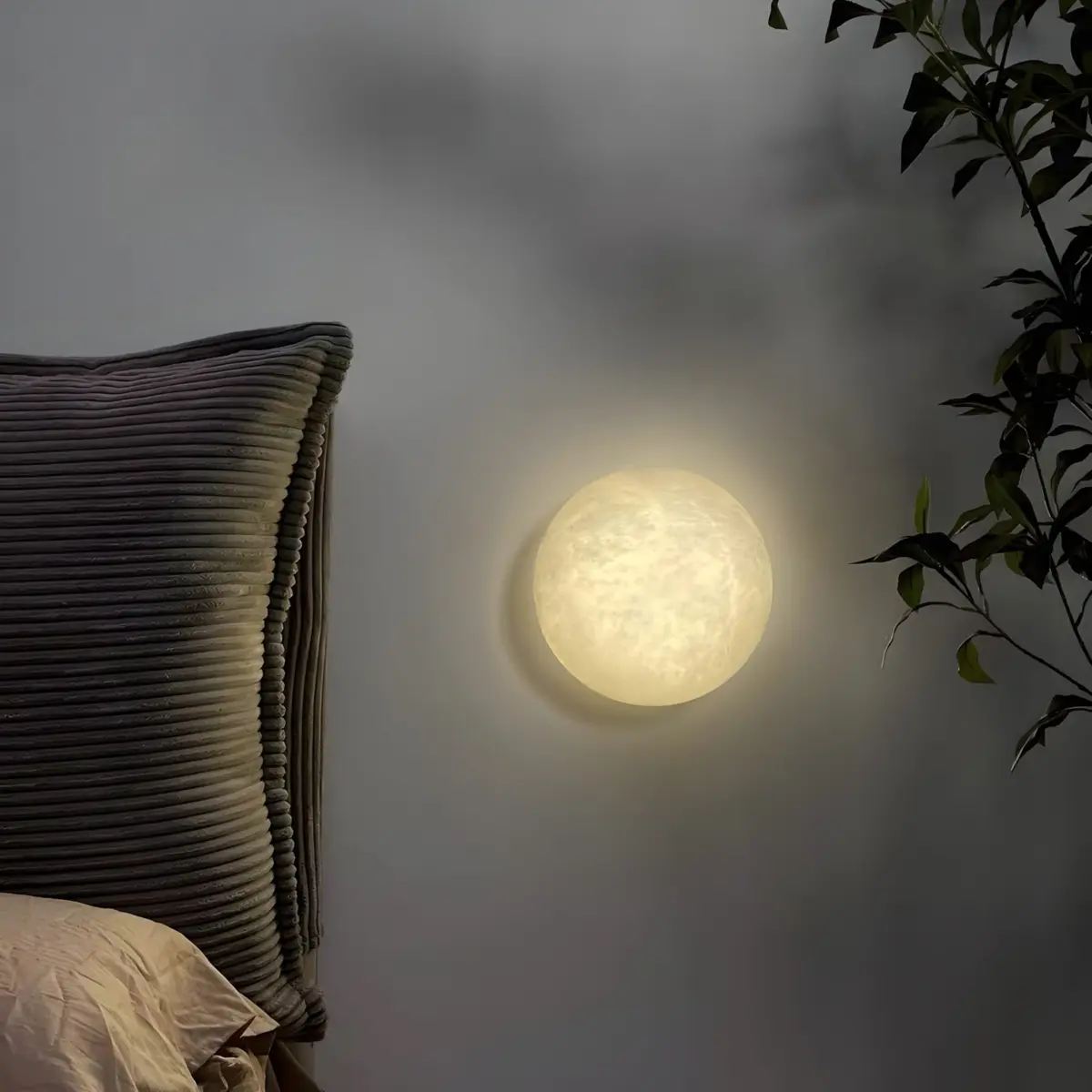 Semicircle moon wall sconce mounted on the bedroom wall