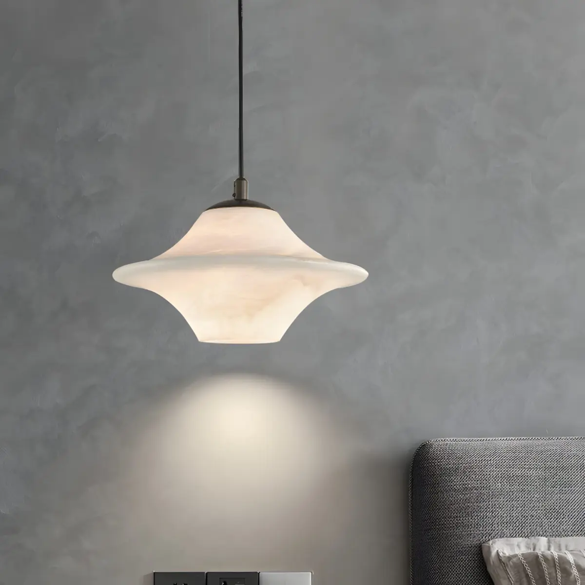UFO alabaster pendant light hanging as bedside lamp