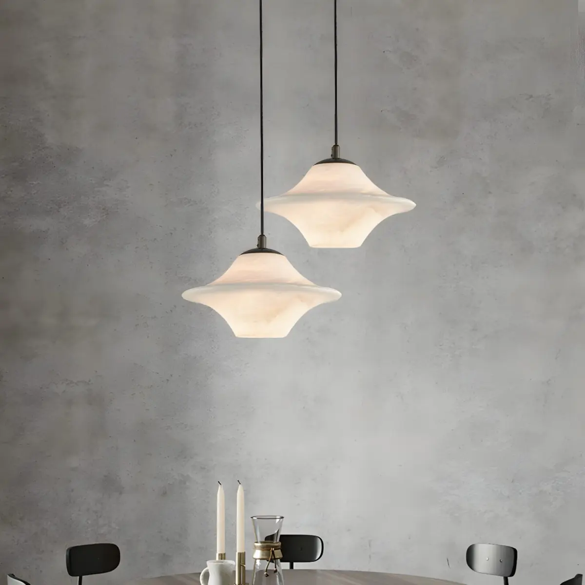 two UFO pendant light hanging above table