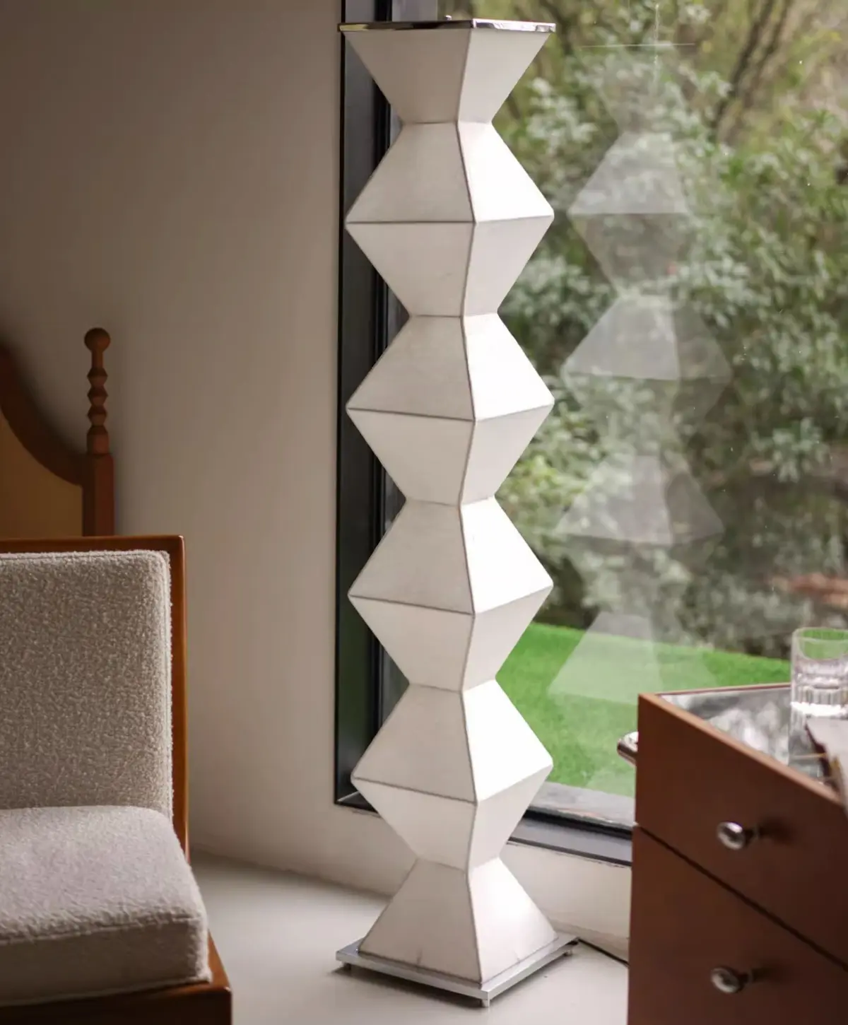 eternal pillar floor lamp standing in front of window