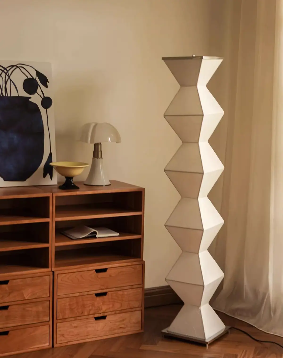 eternal pillar floor lamp standing next to cabinet
