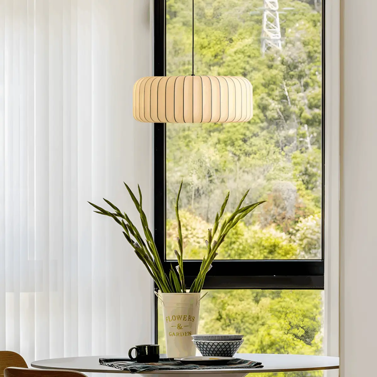 one of the arturesthome wabi-sabi pendant light hanging above dining table