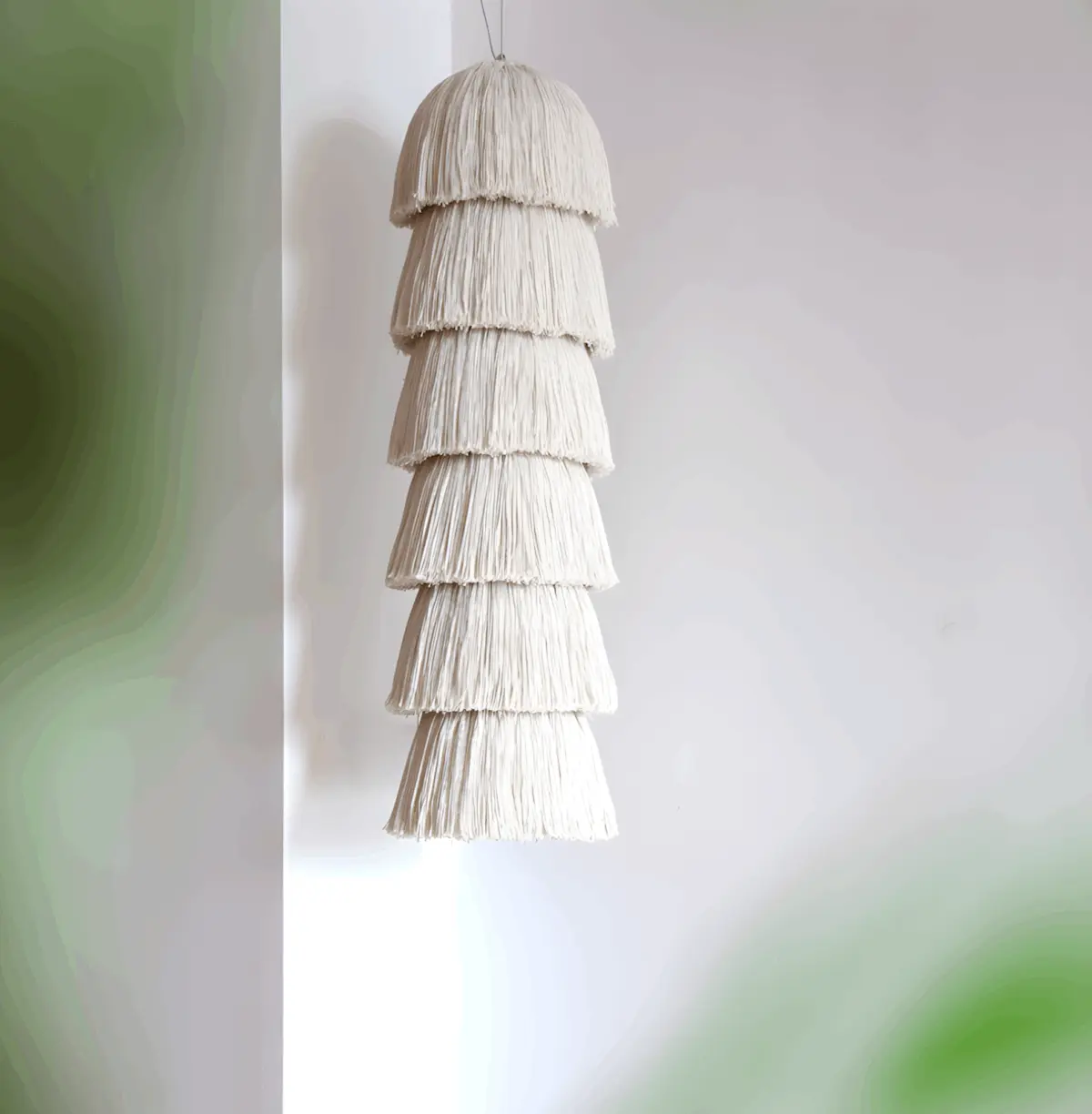 boho yarn pendant light hanging from ceiling