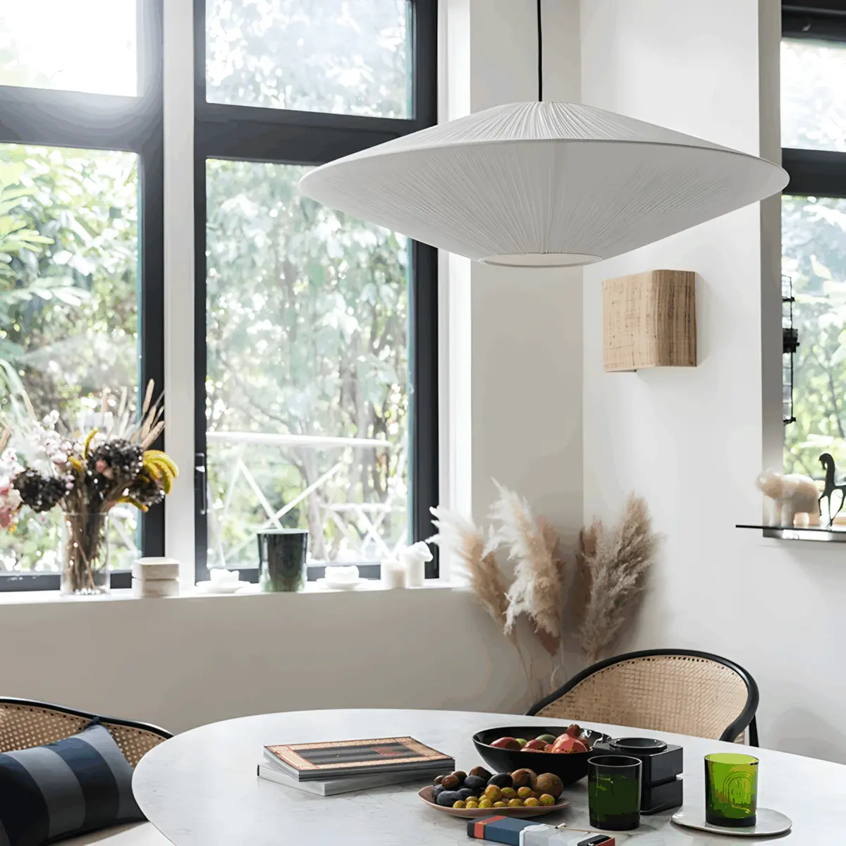 brera fabric pleated pendant light hanging above table