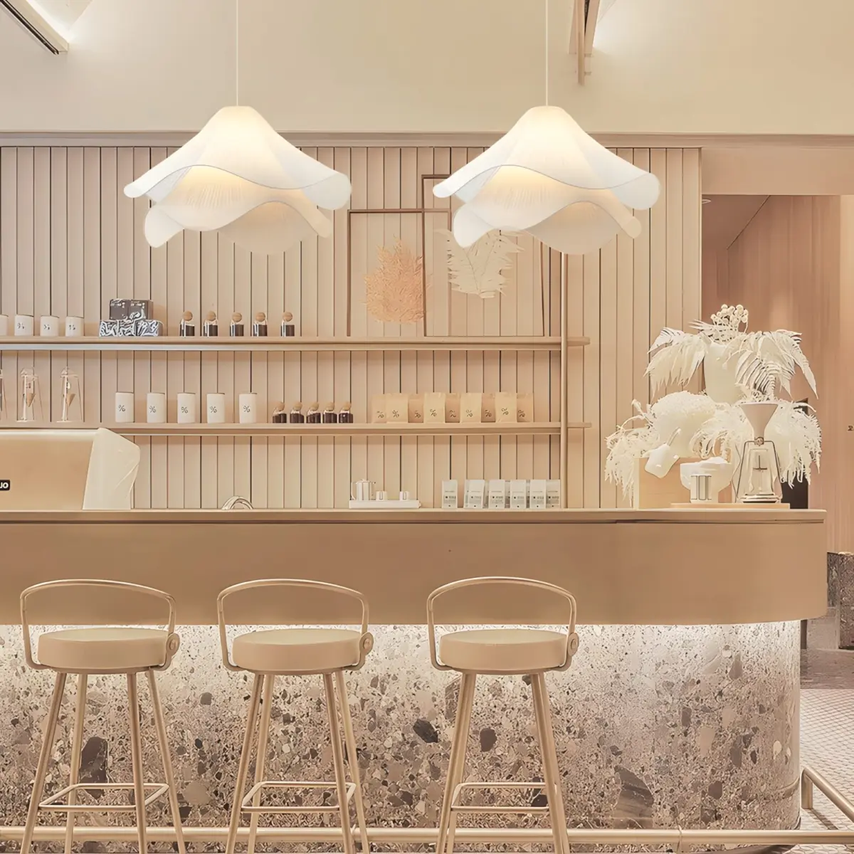two ethereal bloom fabric pendant light hanging above bar counter