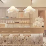 two ethereal bloom fabric pendant light hanging above bar counter