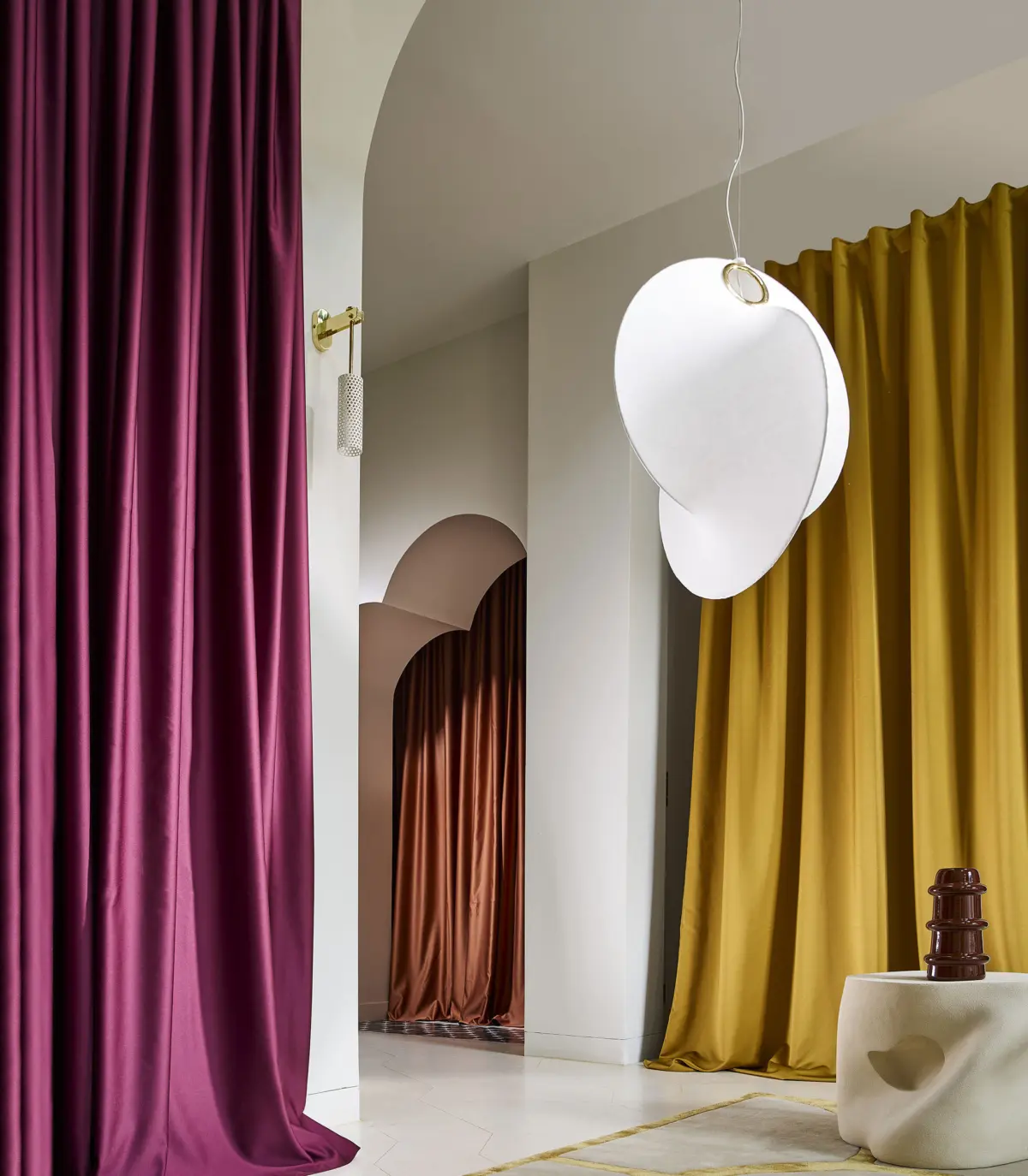 flos overlap silk made pendant light hanging in the fitting room