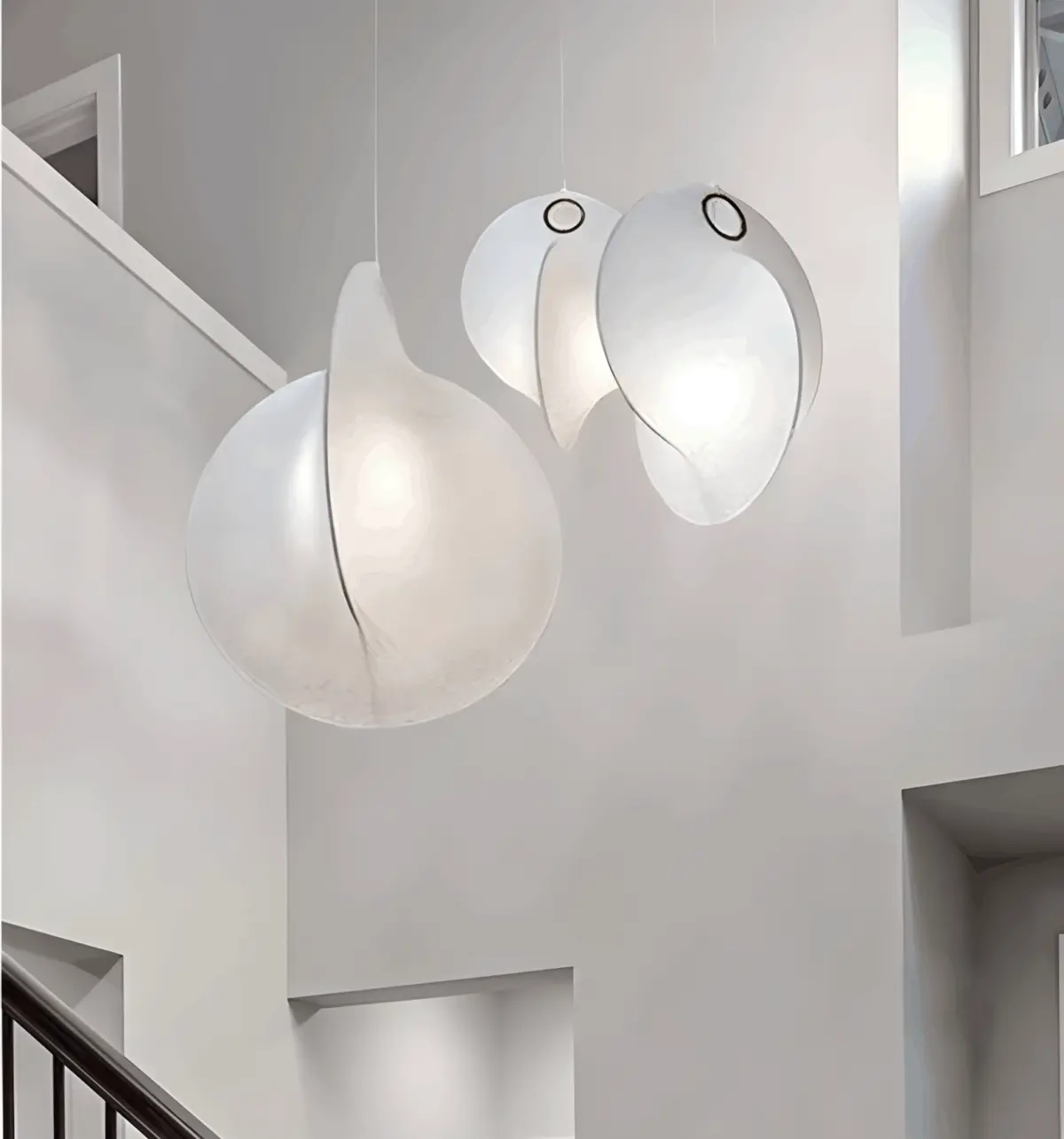flos overlap silk made pendant light hanging in the middle of the staircase