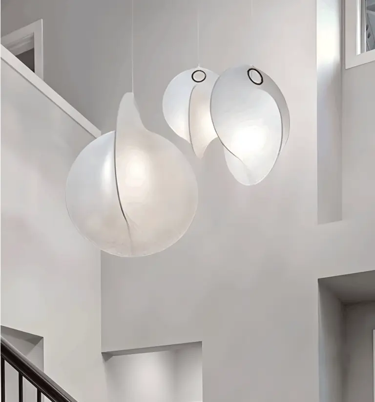 flos overlap silk made pendant light hanging in the middle of the staircase