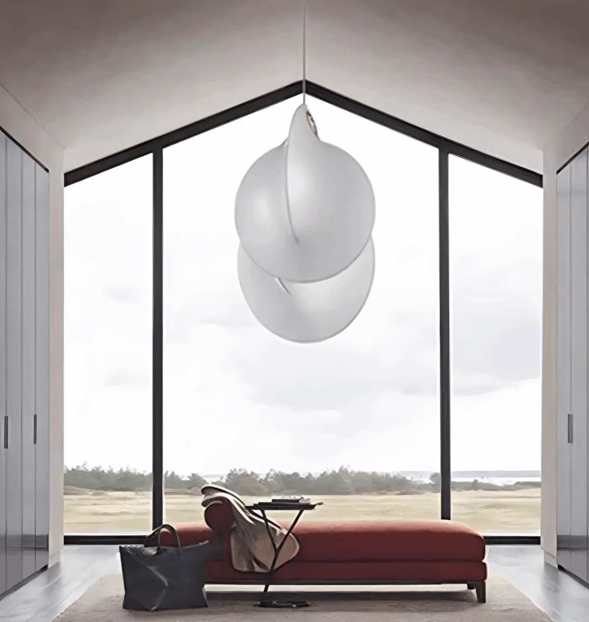 flos overlap silk made pendant light hanging in front of the floor-to-ceiling window