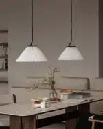 two nebra pleated pendant lamp hang in dining room