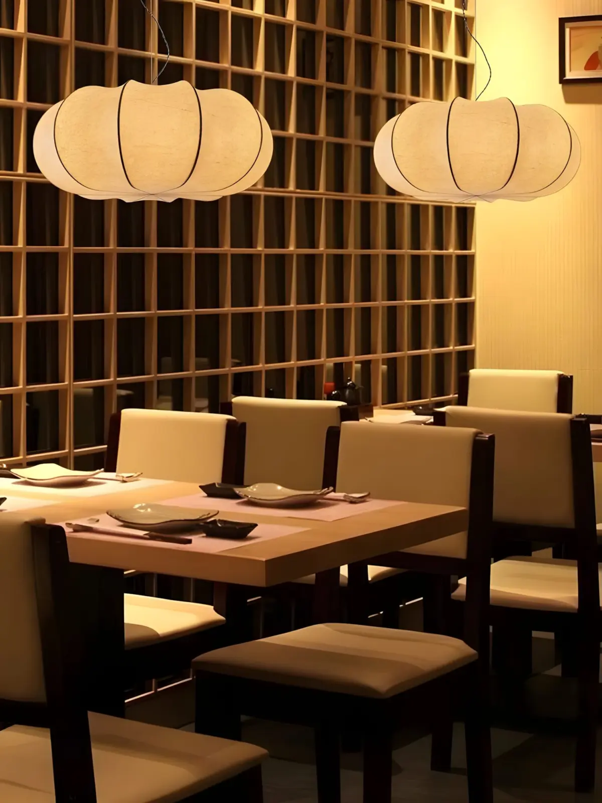 oblate pumpkin shade silk made pendant lamp hanging in a restaurant