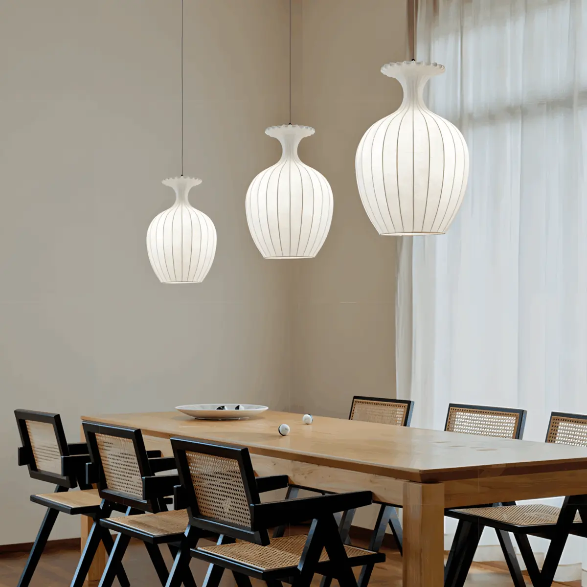 oinos silk made lantern hanging above dining table