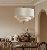 scandinavian pebble fabric pendant light hanging in dining room