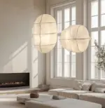 two different size studiopepe tacchini gunta pendant light hanging in living room