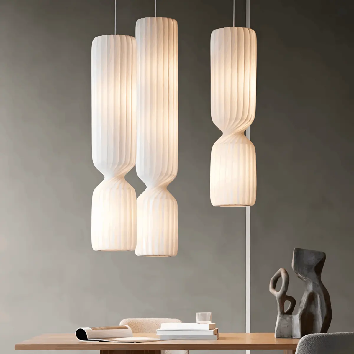 three different size lighted tom rossau tr41 pendant light hanging