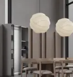 two turner silk made pendant lamp hanging above table set